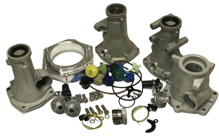 Tail housing kit parts laid out: housings, adapter, gears and hardware